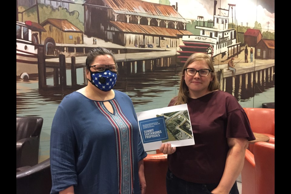 Queensborough residents Starla Lowdell, left, and Laura Ranalletta, are concerned about the impacts a proposed soil transfer facility would have on their community - and the lack of consultation the applicant has had with citizens. Because of health issues, Lodell wears a mask to filter out contaminants in the air.