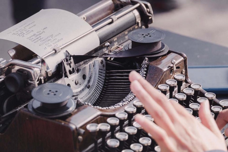 typewriter with hand