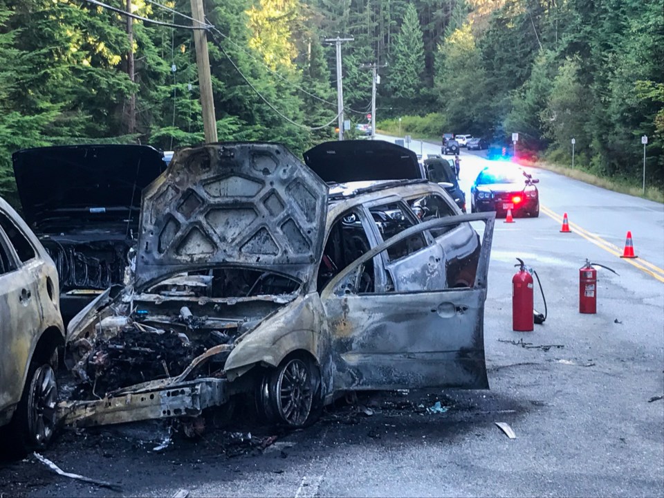 Burnt out vehicles along Bedwell Bay Road following a collision Wednesday, Aug. 14.