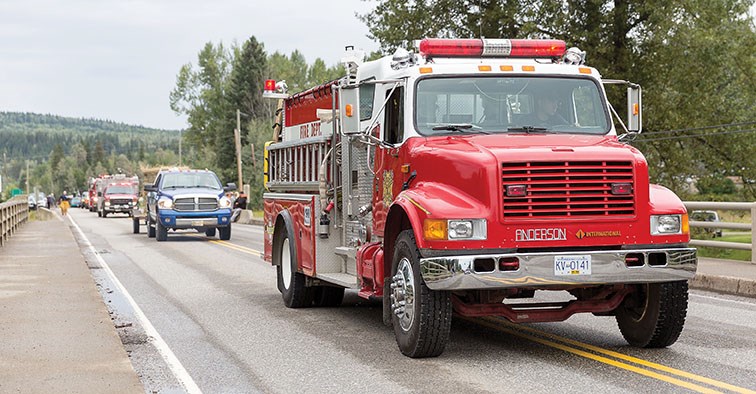 A parade makes its way through Hixon on Saturday morning as part of the Hixon Fall Fair.. Citizen Photo by James Doyle