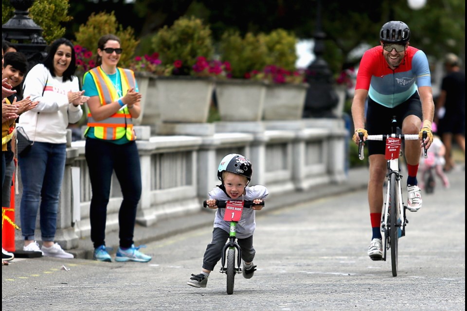 Four-year-old Emmett battles with Ryder Hesjedal during the Kids Race in front of the B.C. legislature during the Ryder Hesjedal Tour de Victoria.