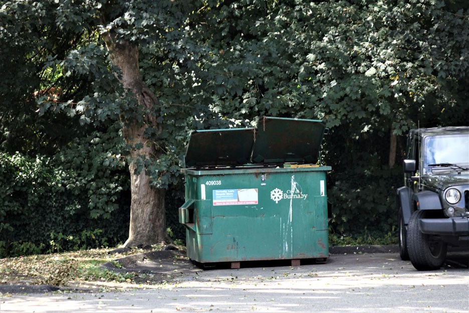 A City of Burnaby dumpster in the Deer Lake. John Preissl photo