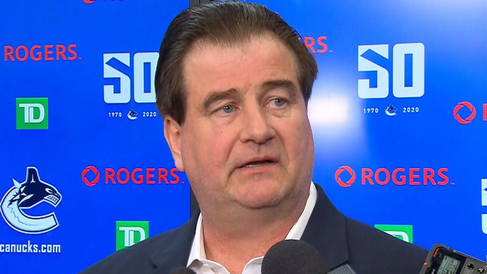 Jim Benning speaks to the media after renewing his contract with the Canucks.