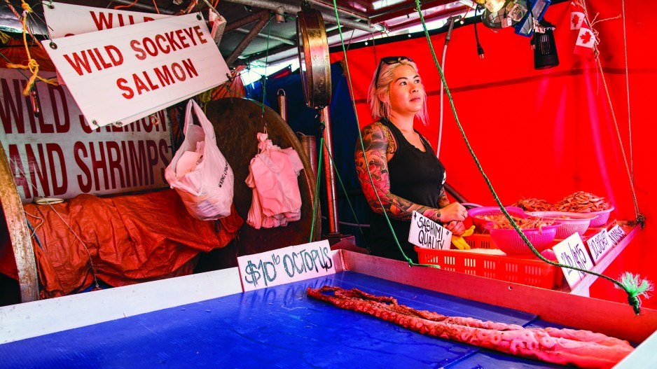 A seafood stall in Steveston advertises wild sockeye salmon. Looming shortfalls threaten this year’s