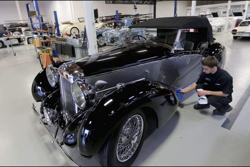 VICTORIA, B.C.: August, 21, 2019 - Coachwerks Automotive Restoration Blake Feltrin works on shining up the 1939 Lagonda v12 Rapide Open Tour, cars destined to be displayed at this weekend's Motorcar Weekend. VICTORIA, B.C. August 21, 2019. (ADRIAN LAM, TIMES COLONIST). For City story by Stand Alone.]]]]