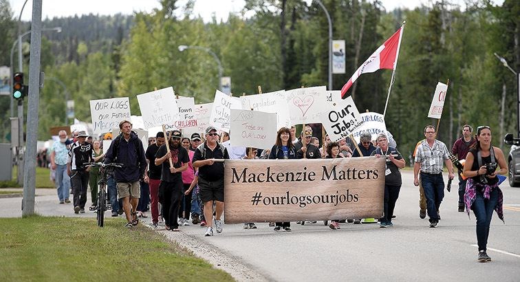 Participants in the Mackenzie Matters rally march from the forestry offices in Mackenzie to the Mackenzie Rec Centre on Thursday afternoon.