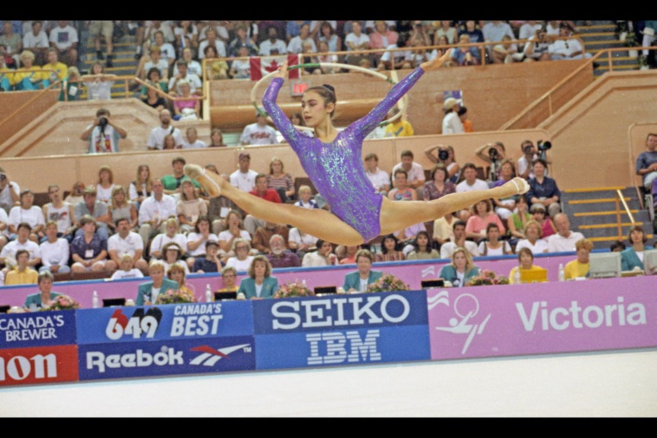 Australia's incomparable Kasumi Takahashi thrills an appreciative crowd a Memorial Arena during the rhythmic gymnastics individual competition. The elegant gymnast won a total of five gold medals at the 1994