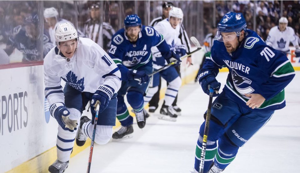 Tanner Pearson skates for the puck for the Vancouver Canucks