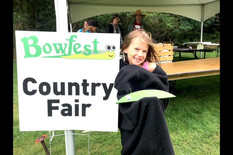 Madison in a human slug race sac in Bowfest field.