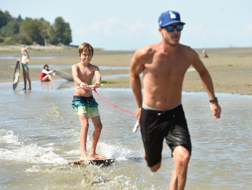 Instructor Torey Bartnik pulls Nolan James around on a rope much like a water skier and a boat at Sp