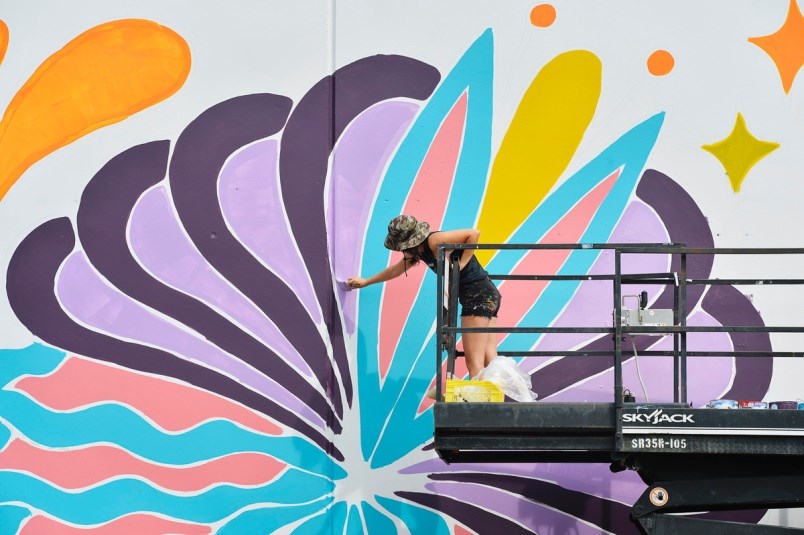 Olivia di Liberto works on her mural for Vancouver Mural Festival. Photo Jennifer Gauthier