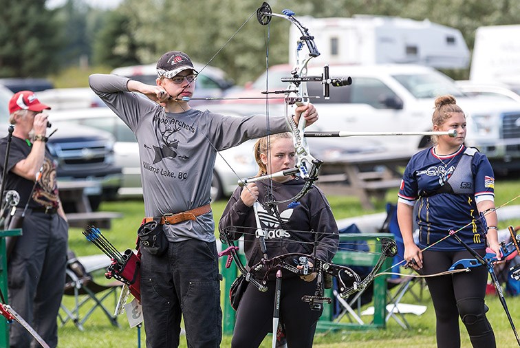 Fourteen-year-old Ty Waterhouse from Williams Lake focuses on the target on Saturday morning at Keith Paterson Field at the Silvertip Archers outdoor facility on Highway 16 East while competing in the Provincial Outdoor Archery championships. Citizen Photo by James Doyle
