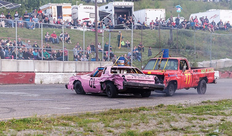 The crowd looks on as Kyle Wozney spins out the #01 car of Edgar Laurin on Saturday evening at PGARA Speedway Park as the pair compete in a bucket race during the Labour Day Classic Hit to Pass event. Citizen Photo by James Doyle