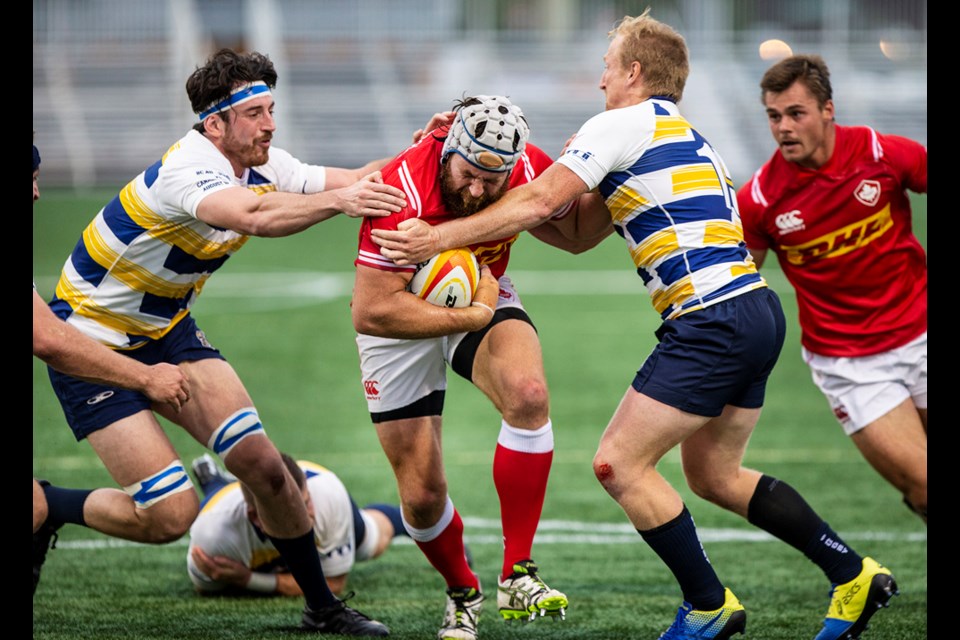 Blake Mahovic, in the white jersey on the right, in action on the pitch Aug. 30.