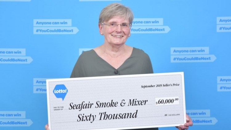 Verna Holmes holds a cheque awarded to her Seafair Smoke & Mixer at Seafair Shopping Centre on Sept.