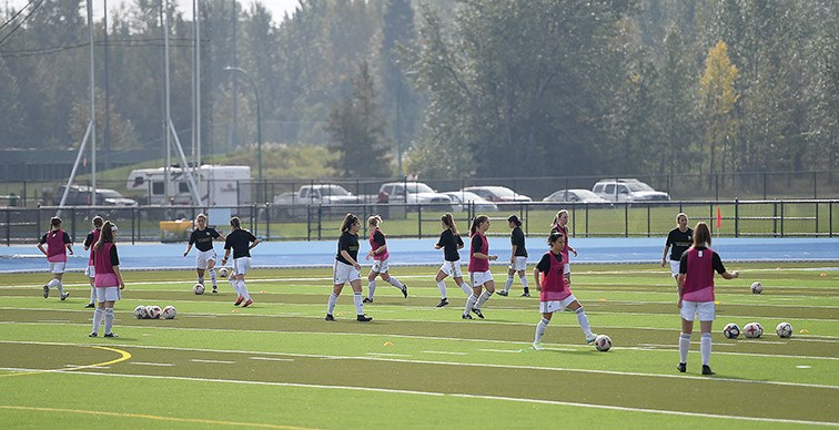 The UNBC women Timberwolves warm up prior to their home opener against Thompson Rivers University WolfPack. Citizen photo by Brent Braaten