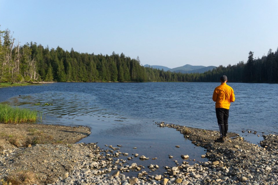 David Egan enjoys the scenery at Eric Lake after a short afternoon of hiking to start the Cape Scott trail.