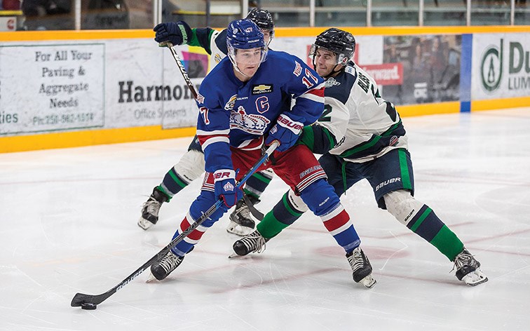 Prince George Spruce Kings forward Nolan Welsh drives to the net while fighting off the check of Surrey Eagles defender Brett Bliss on Saturday night at Rolling Mix Concrete Arena. Citizen Photo by James Doyle