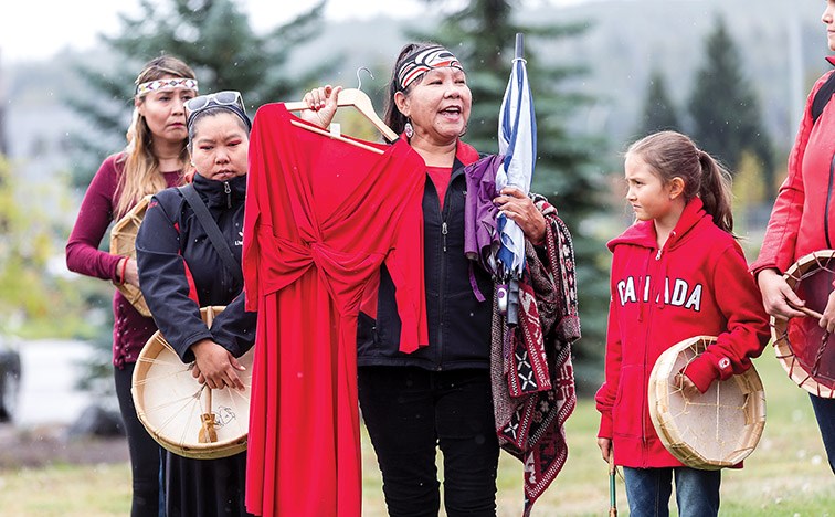 Empty red dresses were held up by the nearly fifty men, women, and children who participated in this year’s Red Dress Campaign on Sunday afternoon at the junction of Hwy 97 and Hwy 16. Citizen Photo by James Doyle