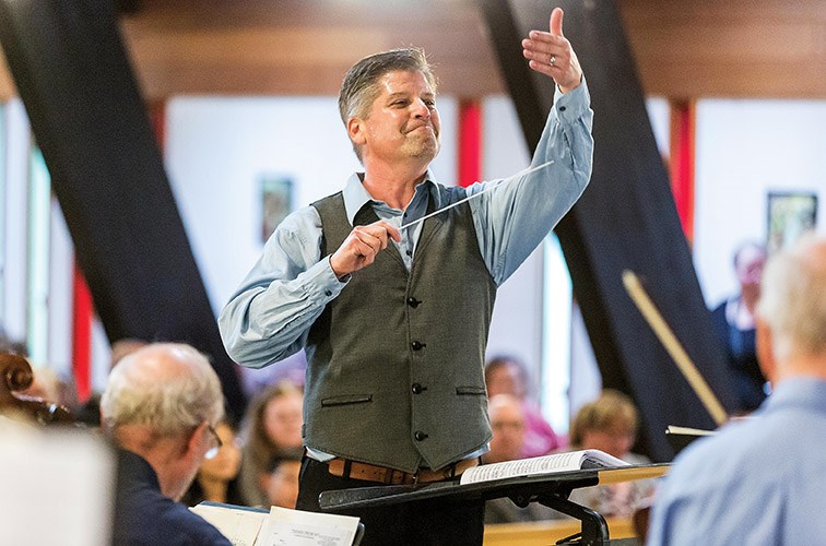 Maestro Michael Hall leads the Prince George Symphony Orchestra during their annual Pops in the Park concert at St. Michael’s Church on Sunday afternoon. Citizen Photo by James Doyle