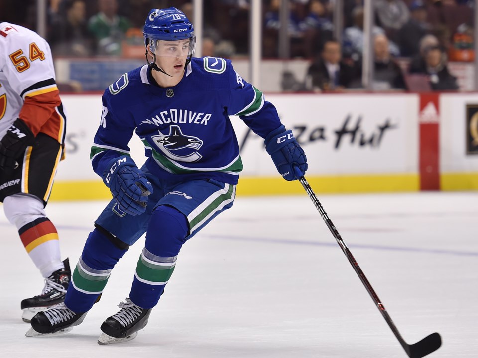 Kole Lind skates for the Vancouver Canucks in preseason action.