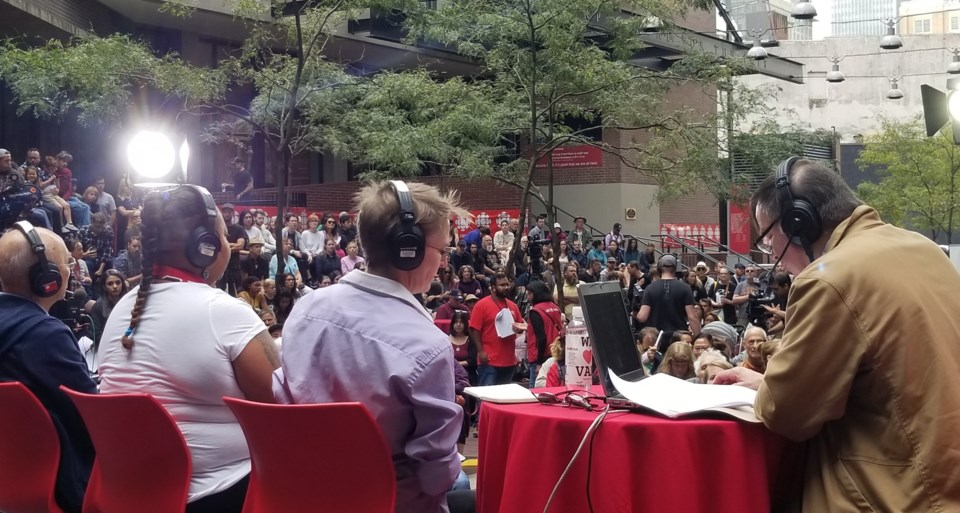 CBC Early Edition host Stephen Quinn and a panel of local residents and activists address the audien