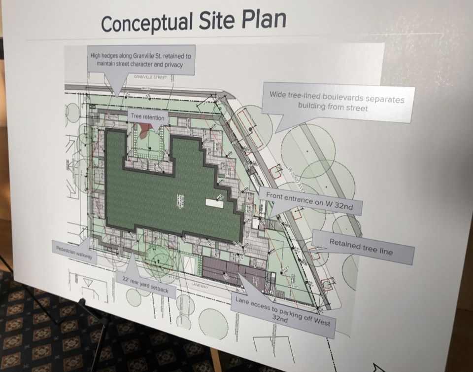 A display board at the pre-application open house shows the conceptual site plan.