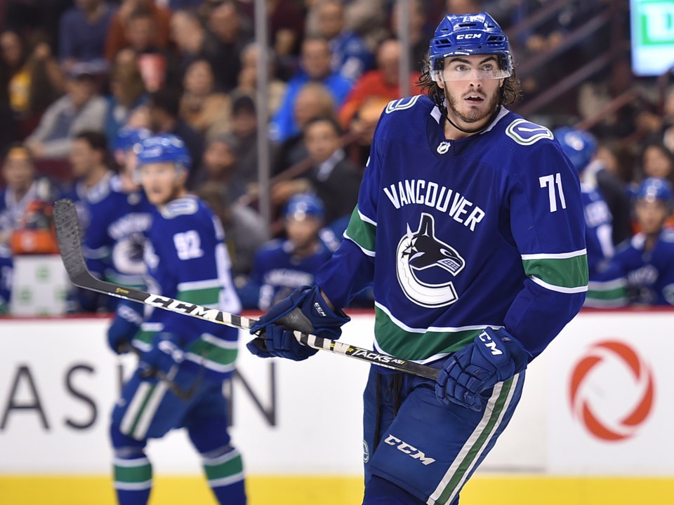 Zack MacEwen skates for the Canucks in the 2018 preseason.