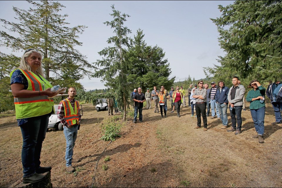 VICTORIA, B.C.: September, 11, 2019 - Bevin Wigmore (R), Tree Improvement Manager leads a tour, as people come out to celebrate Mosaic