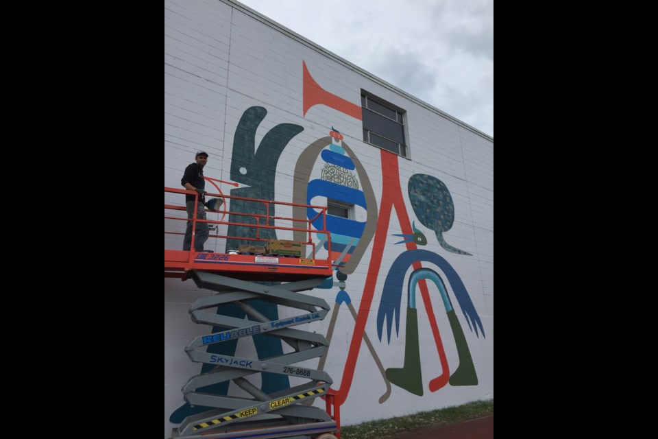 Artist Luke Ramsey has begun working on the Bowker Creek Mural. The mural is being installed on the large wall that overlooks the Jack Wallace Track at Oak Bay High School.