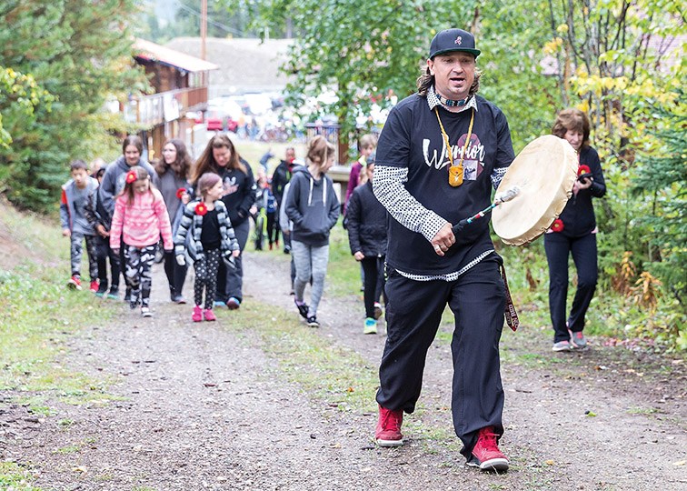 Wesley Mitchell plays the drum while leading roughly 120 walkers through the the trails at Otway Nordic Centre while participating in the 3rd annual Prince George Multiple Myeloma March in September 2019. Citizen Photo by James Doyle