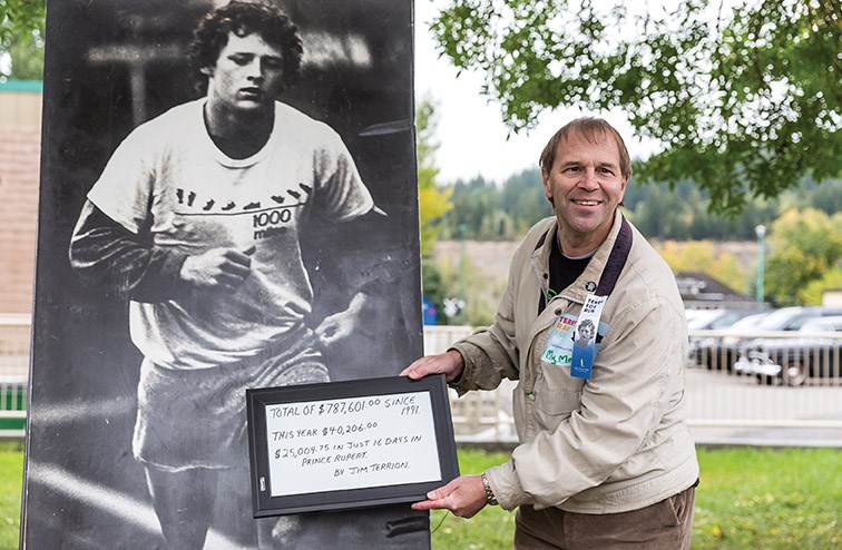 Jim Terrion poses with a poster of Terry Fox on Sunday morning at Lheidli T’enneh Memorial Park prior to the start of the 39th annual Prince George Terry Fox Run. Since 1991 Terrion has raised $787,601 for the Terry Fox Foundation. Citizen photo by James Doyle