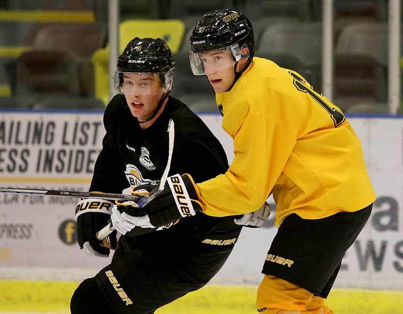 Coquitlam Exress coach Jason Fortier says Port Moody's Ryan Tattle, right, is a hard skater in the offensive and defensive zones. The rookie forward earned a place on the team after playing two games as an affiliate call-up from his Major Midget team last year.