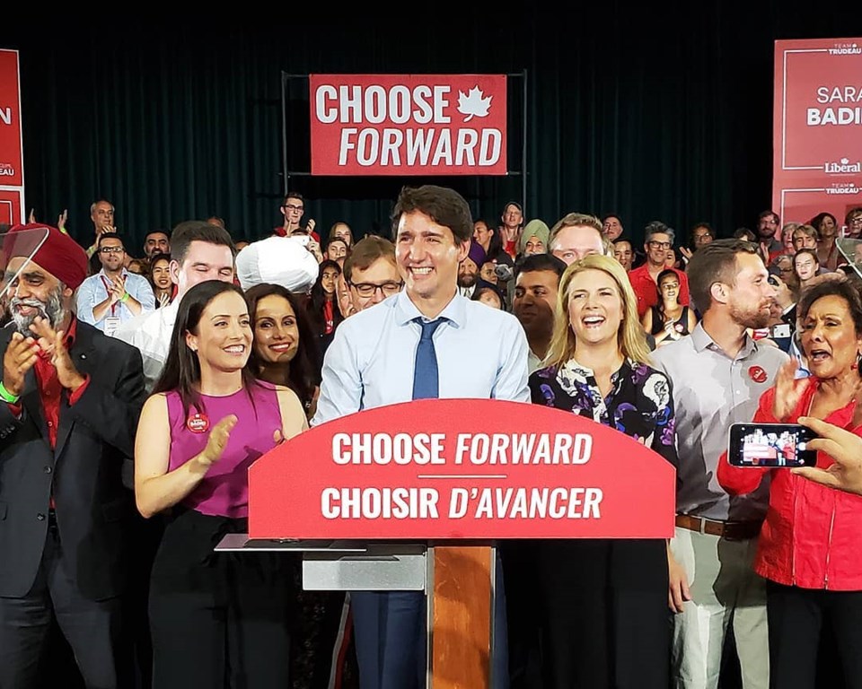 Sara Badiei and Tamara Taggart flank Justin Trudeau as the Liberals kick off their campaign at an ev