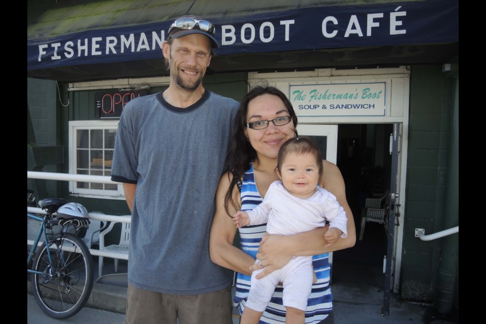 Jason De Ruiter, and his wife, Mary Lou, with their little girl Cecilia. The family took recently took over the running of the rather unique Fisherman's Boot Cafe, deep in the heart of Steveston Harbour. Alan Campbell photo