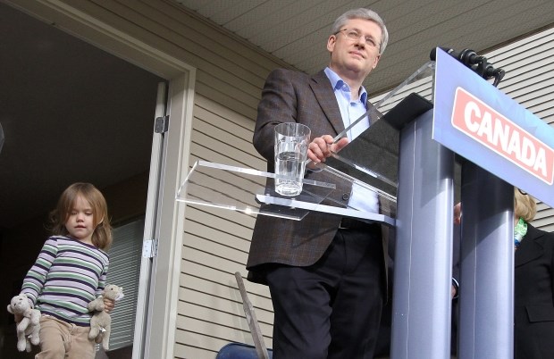 Prime Minister Stephen Harper visits and talks to the media at the Wellburn home in Saanich.  Fiona Wellburn plays to the left of Harper. (March  28, 2011)