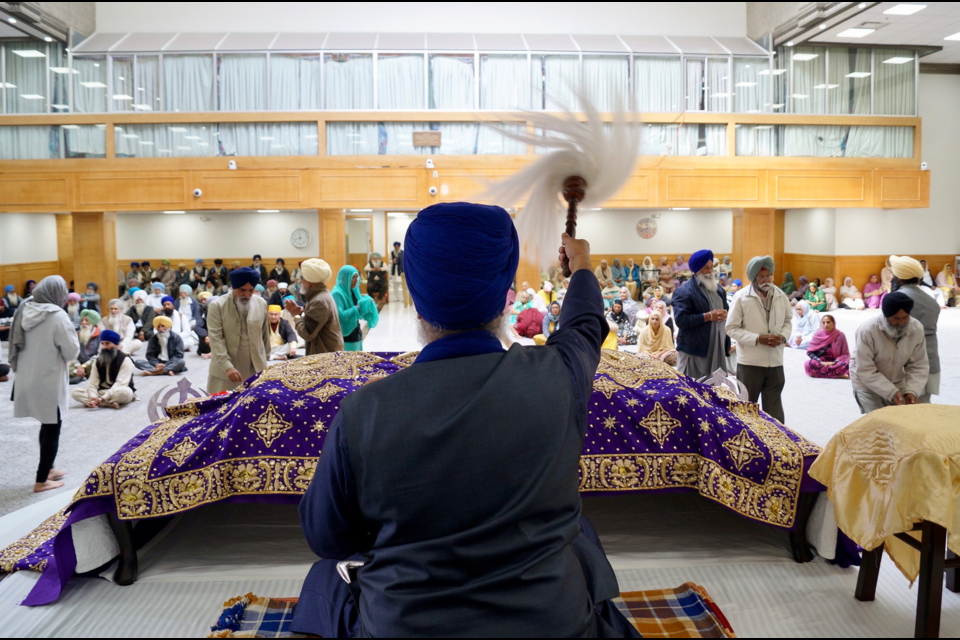 Worshippers attend the Guru Nanak Sikh Gurdwara in Surrey