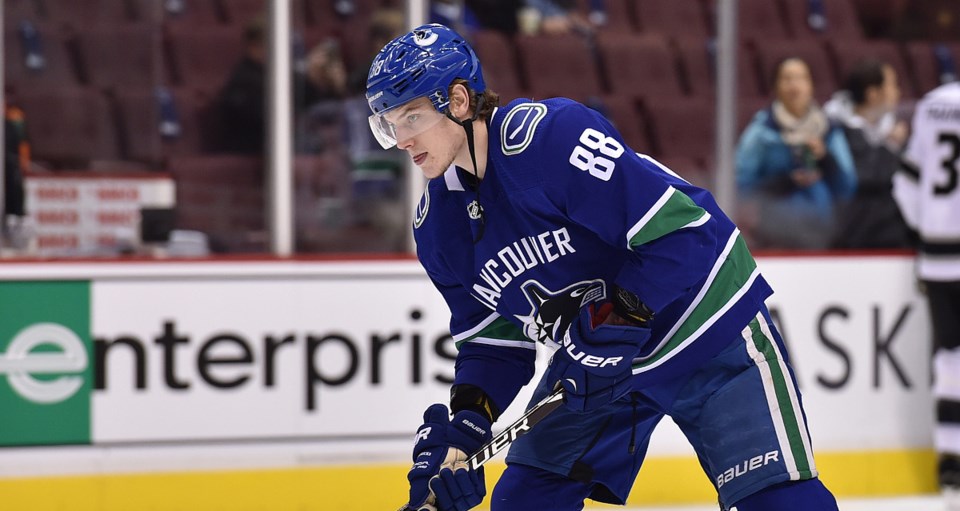 Adam Gaudette warms up with the Vancouver Canucks.