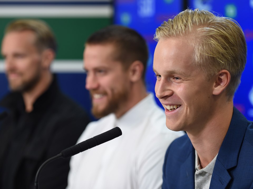 Elias Pettersson laughs at a question during Canucks 2019 media day.