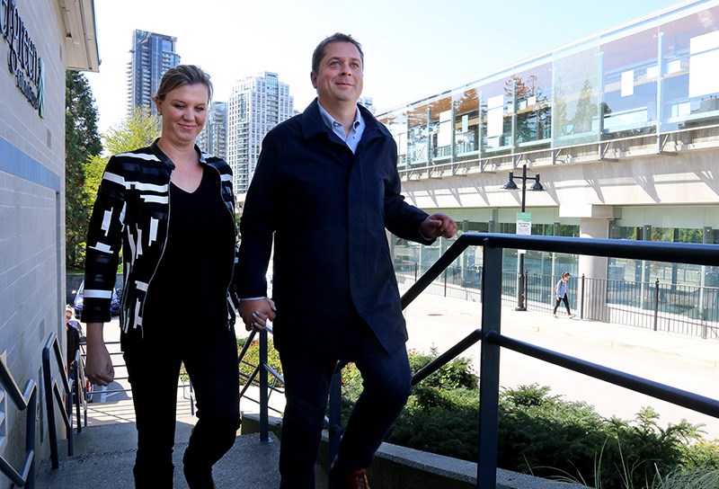 MARIO BARTEL/THE TRI-CITY NEWS Conservative party leader Andrew Scheer arrives at Coquitlam's Evergreen Cultural Centre Friday, with his wife, Jill, to make an announcement about transportation infrastructure.