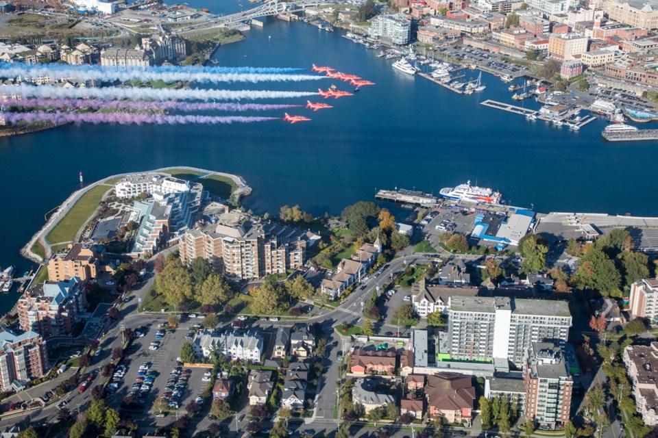 The Royal Air Force aerobatic team, the Red Arrows, performs a flypast over Victoria's Inner Harbour on Thursday, Sept. 26, 2019.