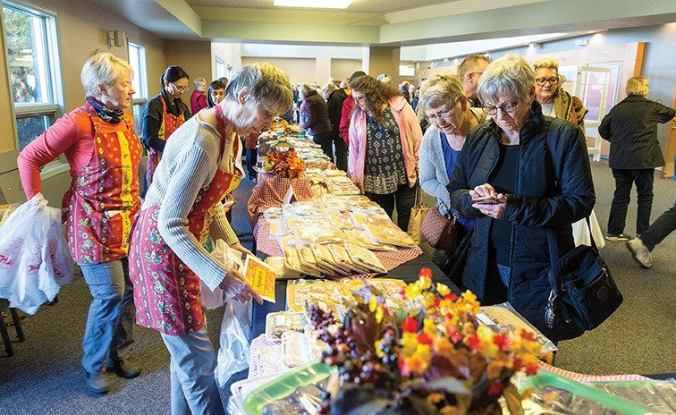 Patrons check out the many baked goods for sale on Saturday at the Westwood Mennonite Brethren Church during the annual Mennonite Fall Fair. Citizen Photo by James Doyle