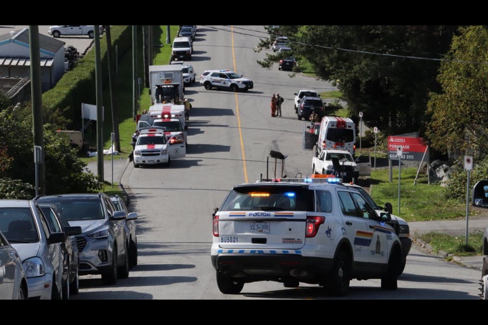 The compressor seen in the far left of this photo is believed to have rolled down this hill in Burnaby and killed a worker. Shane MacKichan photo