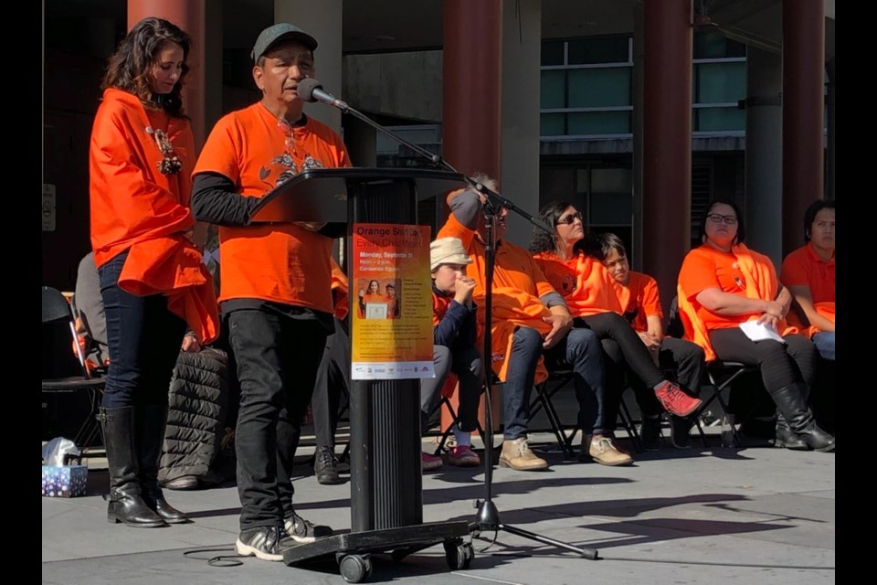 Eddy Charlie, an organizer of the first Orange Shirt Day in Victoria, with Kristin Spray on Monday at Centennial Square. Sept. 30, 2019