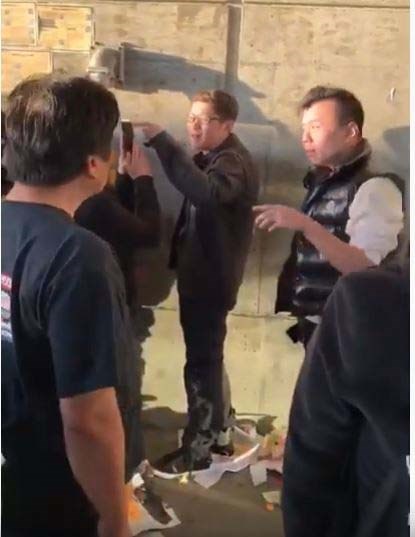 Pro-China supporters (right) clashed with Pro-Hong Kong supporters underneath the Aberdeen Canada Line station on Tuesday afternoon. Screenshots