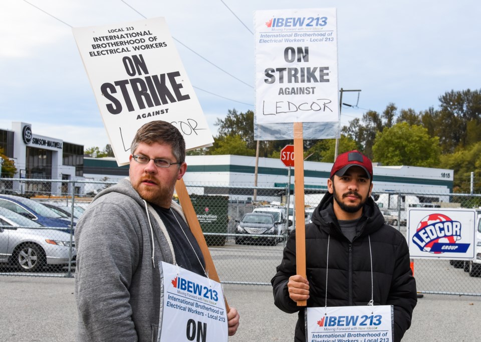 Workers strike outside Port Coquitlam's Ledcor facility