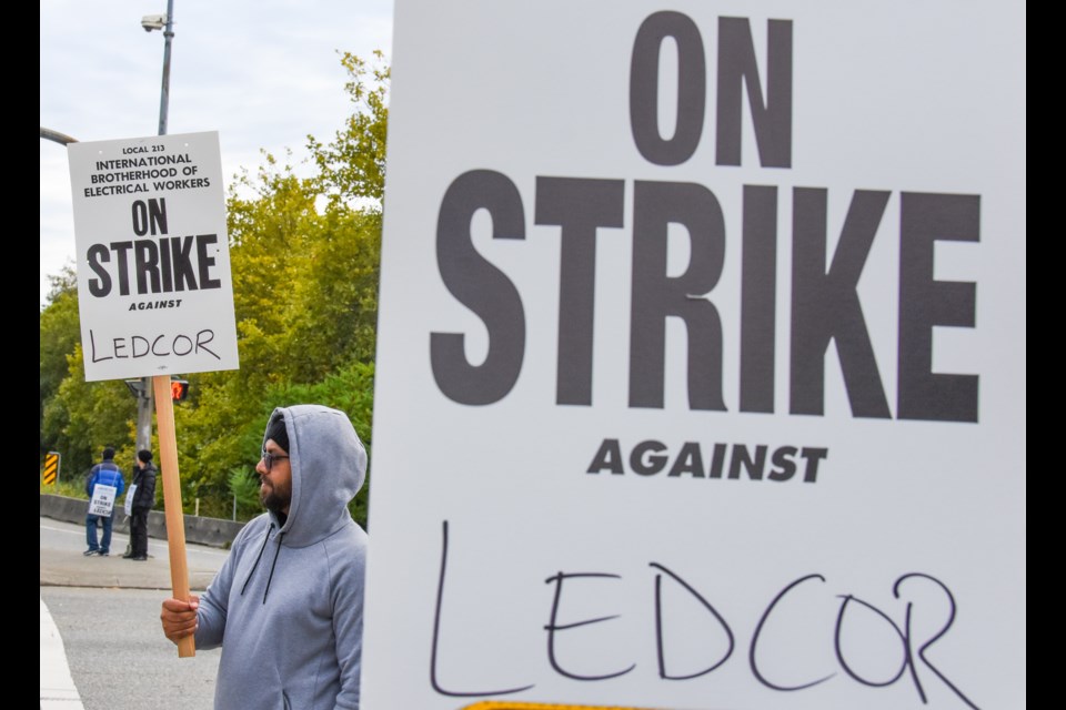 The telecommunication technicians strike from IBEW 213 strike at the intersection of Broadway St. and Mary Hill Bypass in Port Coquitlam