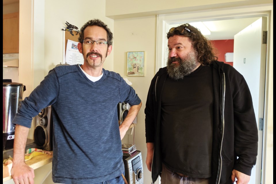 Comedian Toby Hargrave (right) chats with Arrowhead Clubhouse project lead Foye Hatton on a recent visit to the Clubhouse.