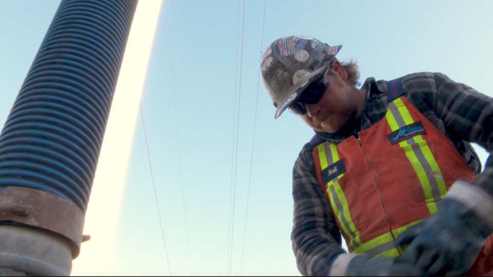 A worker sucks out "fatbergs" from a metro sewer