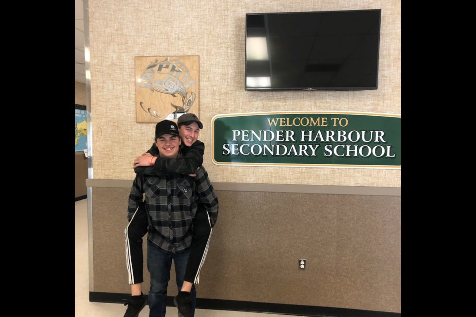 Jakob Thornton (front) and Nolan Johnston at Pender Harbour Secondary School the day after they discovered a 90-year-old man trapped in his car on a remote road in the area.